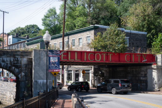 Ellicott City/ Baltimore dispensary showing image of downtown Ellicott City walking bridge 